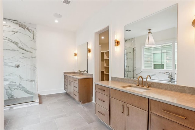 6371 Louis Xiv St, New Orleans, LA 70124 - bathroom with a marble finish shower, vanity, recessed lighting, a walk in closet, and tile patterned flooring