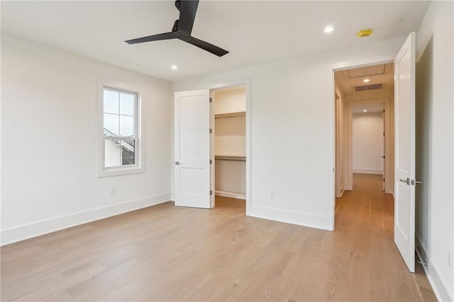 6371 Louis Xiv St, New Orleans, LA 70124 - unfurnished bedroom with attic access, light wood-type flooring, recessed lighting, a walk in closet, and ceiling fan