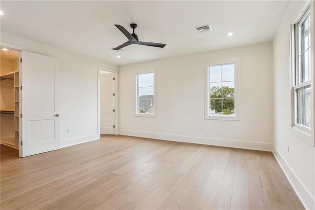 6371 Louis Xiv St, New Orleans, LA 70124 - unfurnished bedroom with light wood-style flooring, a walk in closet, recessed lighting, and ceiling fan