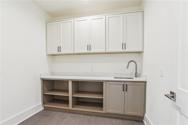6371 Louis Xiv St, New Orleans, LA 70124 - kitchen featuring tile patterned floors, light countertops, and open shelves