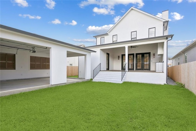 6371 Louis Xiv St, New Orleans, LA 70124 - rear view of property with a ceiling fan, stucco siding, a patio area, and a chimney