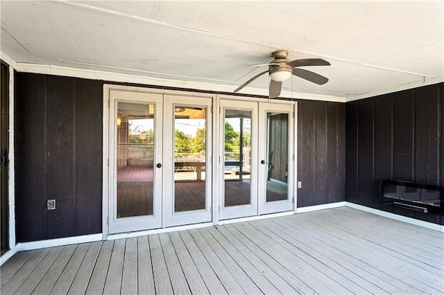wooden deck featuring french doors and ceiling fan