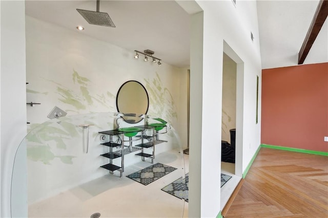 corridor with baseboards and visible vents