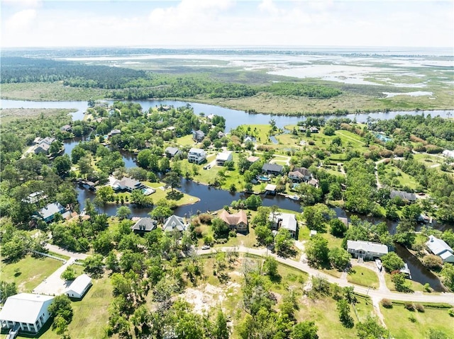 bird's eye view featuring a water view and a residential view