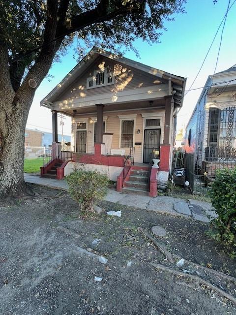 275755 Toulouse St, New Orleans, LA 70119 - view of front facade featuring covered porch
