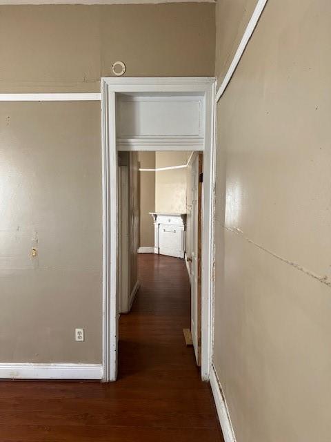 275755 Toulouse St, New Orleans, LA 70119 - hall with dark wood-style flooring and baseboards