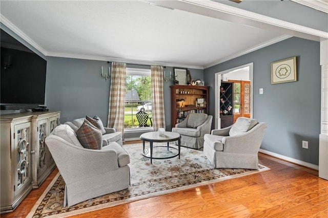 616 Marilyn Dr, Mandeville, LA 70448 - living area featuring baseboards, crown molding, and wood finished floors