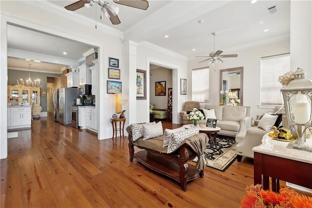 727 N Salcedo St, New Orleans, LA 70119 - living room with dark wood-type flooring, visible vents, ceiling fan with notable chandelier, and crown molding