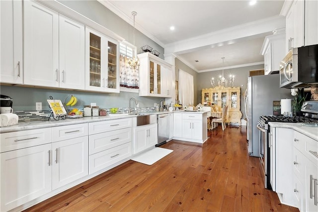 727 N Salcedo St, New Orleans, LA 70119 - kitchen featuring white cabinetry, light countertops, and appliances with stainless steel finishes