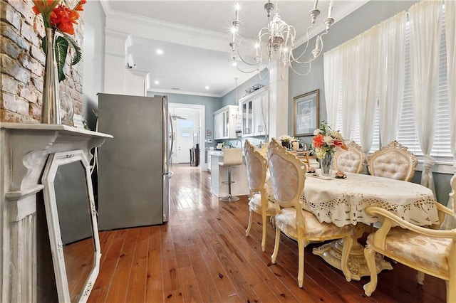 727 N Salcedo St, New Orleans, LA 70119 - dining area featuring ornamental molding, hardwood / wood-style floors, and a notable chandelier