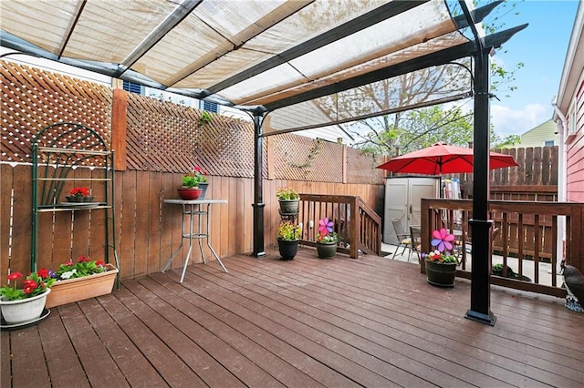 727 N Salcedo St, New Orleans, LA 70119 - wooden terrace with a fenced backyard, an outdoor structure, and a pergola