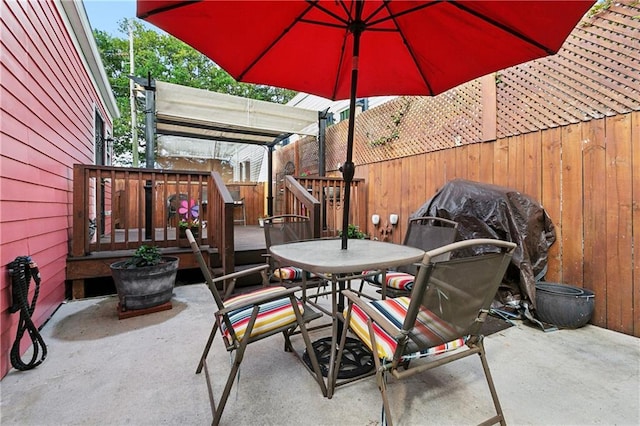 727 N Salcedo St, New Orleans, LA 70119 - view of patio featuring outdoor dining area, a wooden deck, and fence