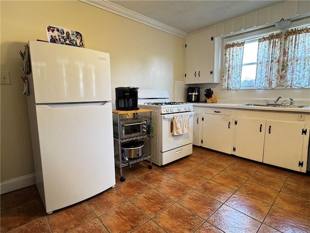 kitchen with crown molding, white appliances, white cabinetry, light countertops, and a sink