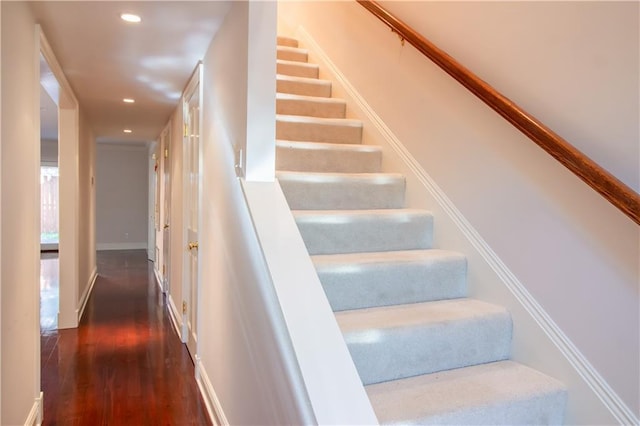 stairs featuring recessed lighting, baseboards, and wood finished floors