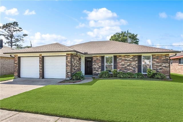 ranch-style home featuring a front yard, brick siding, driveway, and an attached garage