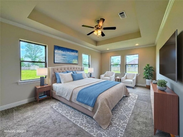 9508 E Terran Ln, Waggaman, LA 70094 - bedroom featuring a tray ceiling, carpet, crown molding, and a ceiling fan