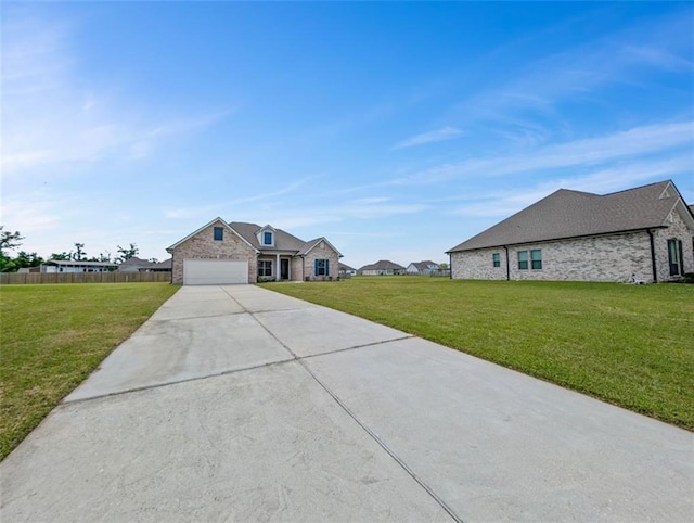 9508 E Terran Ln, Waggaman, LA 70094 - view of front of property with stone siding, driveway, and a garage