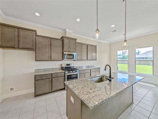 9508 E Terran Ln, Waggaman, LA 70094 - kitchen featuring appliances with stainless steel finishes, light tile patterned flooring, light stone countertops, decorative light fixtures, and ornamental molding