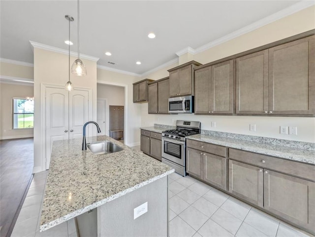 9508 E Terran Ln, Waggaman, LA 70094 - kitchen with appliances with stainless steel finishes, crown molding, light tile patterned floors, recessed lighting, and light stone countertops