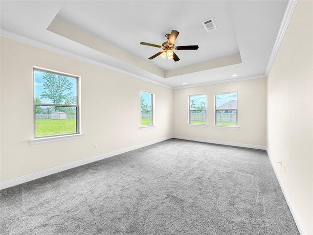 9508 E Terran Ln, Waggaman, LA 70094 - carpeted spare room featuring a tray ceiling, plenty of natural light, ceiling fan, ornamental molding, and recessed lighting