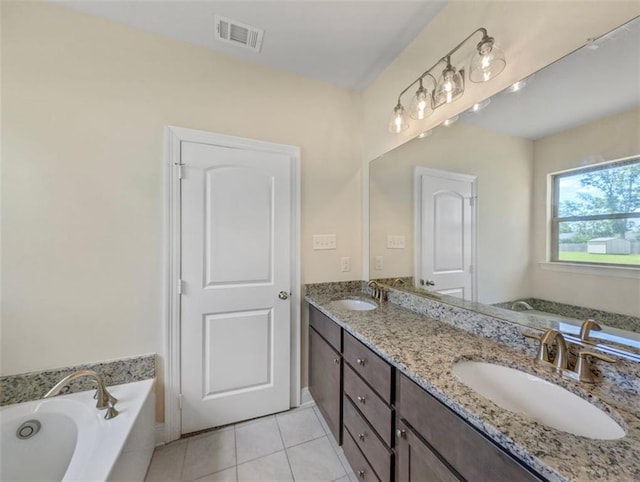 9508 E Terran Ln, Waggaman, LA 70094 - bathroom featuring double vanity, a bath, and tile patterned floors