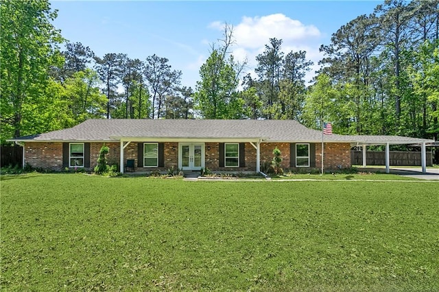 123 Fischer Dr, Pearl River, LA 70452 - ranch-style home with french doors, a front lawn, an attached carport, fence, and brick siding