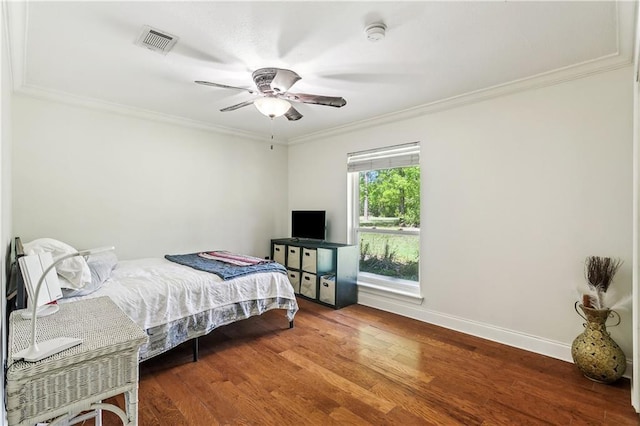 123 Fischer Dr, Pearl River, LA 70452 - bedroom featuring baseboards, visible vents, a ceiling fan, wood finished floors, and ornamental molding