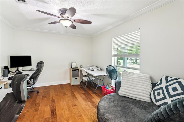 123 Fischer Dr, Pearl River, LA 70452 - office area featuring visible vents, baseboards, wood finished floors, ceiling fan, and crown molding
