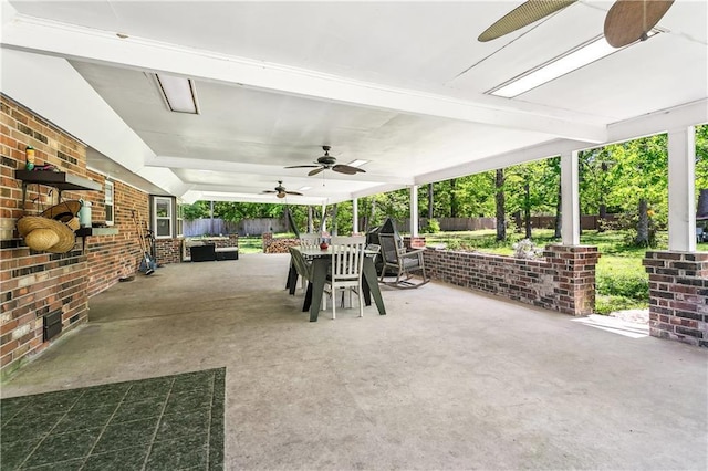123 Fischer Dr, Pearl River, LA 70452 - view of patio featuring outdoor dining area, a ceiling fan, and a fenced backyard