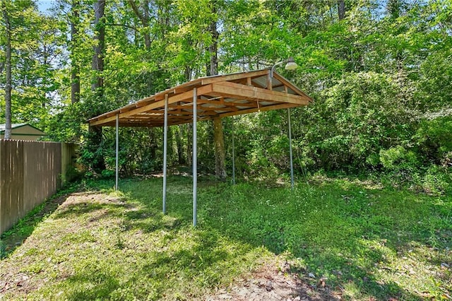 123 Fischer Dr, Pearl River, LA 70452 - view of yard featuring fence and a detached carport