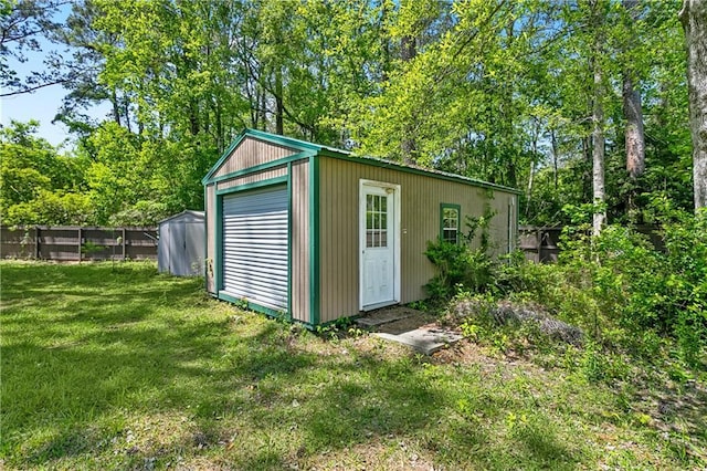 123 Fischer Dr, Pearl River, LA 70452 - view of outdoor structure featuring fence and an outbuilding