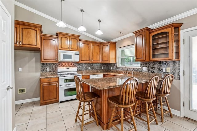 1601 Carthage Dr, Marrero, LA 70072 - kitchen featuring crown molding, a sink, brown cabinets, white appliances, and lofted ceiling