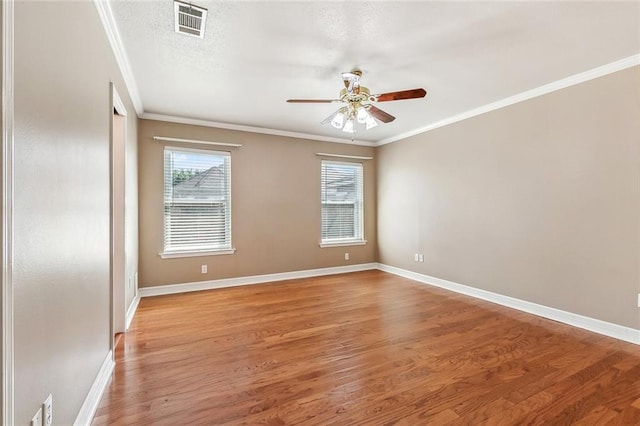 1601 Carthage Dr, Marrero, LA 70072 - unfurnished room featuring crown molding, ceiling fan, light wood-style flooring, baseboards, and visible vents