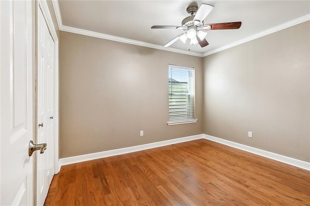 1601 Carthage Dr, Marrero, LA 70072 - empty room featuring wood finished floors, a ceiling fan, baseboards, and ornamental molding
