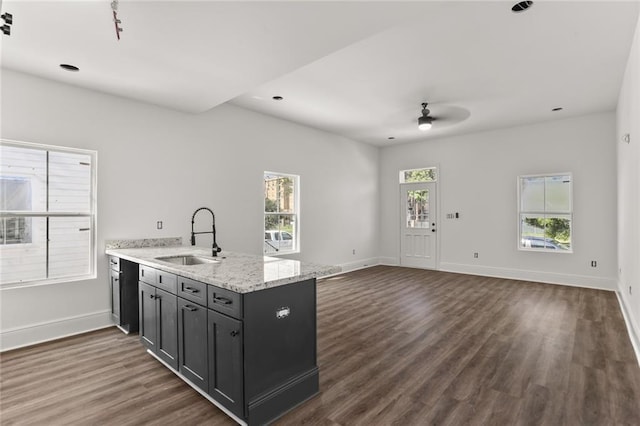201012 N Dorgenois St, New Orleans, LA 70119 - kitchen featuring a peninsula, baseboards, dark wood finished floors, and a sink