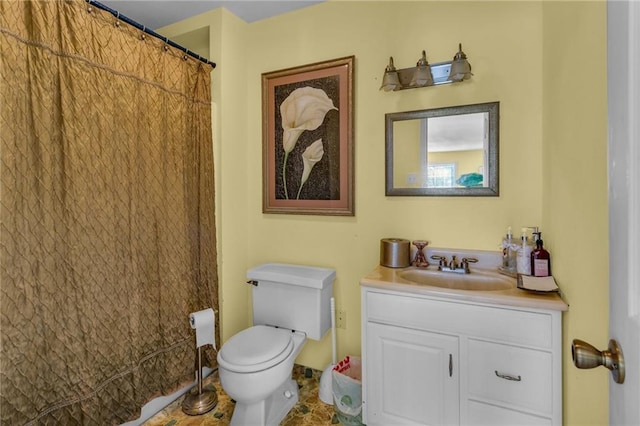 full bathroom with toilet and vanity