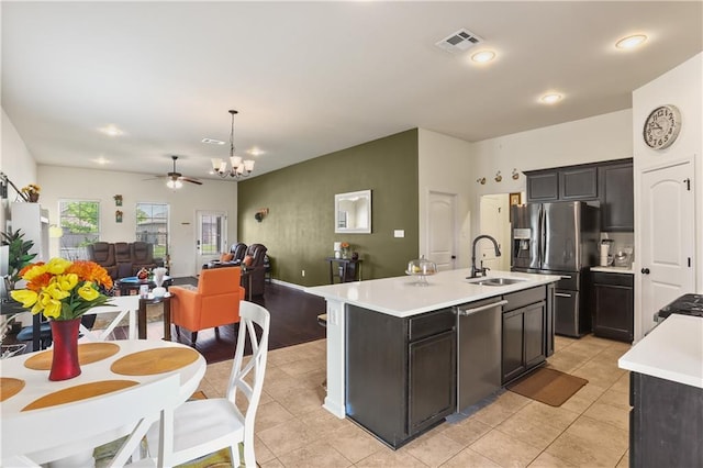 42403 Tigers Eye Stone Ave, Prairieville, LA 70769 - kitchen featuring stainless steel appliances, light countertops, visible vents, a sink, and open floor plan