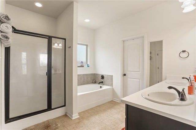 42403 Tigers Eye Stone Ave, Prairieville, LA 70769 - bathroom featuring a bath, a shower stall, tile patterned flooring, and a sink