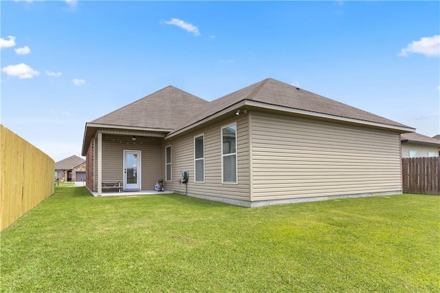 42403 Tigers Eye Stone Ave, Prairieville, LA 70769 - back of house with a yard, a patio, and fence