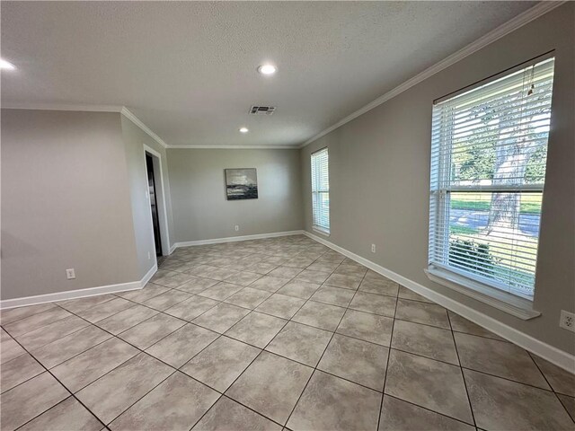 428 Charles Ct, Slidell, LA 70458 - spare room with a textured ceiling, crown molding, light tile patterned flooring, recessed lighting, and baseboards