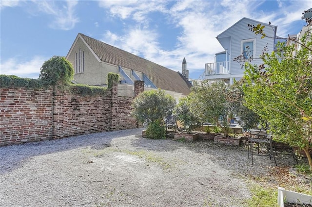 1323 Esplanade Ave Unit C, New Orleans, LA 70116 - view of yard with a balcony