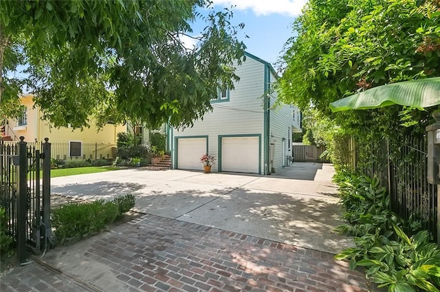 2820 Desoto St, New Orleans, LA 70119 - view of front of home with concrete driveway and an attached garage