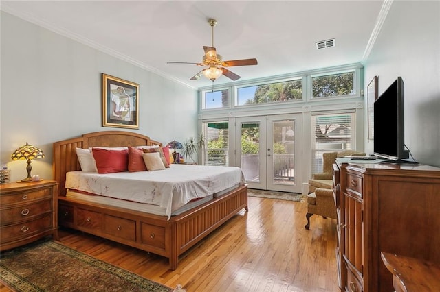 2820 Desoto St, New Orleans, LA 70119 - bedroom with french doors, ornamental molding, access to exterior, light wood-style floors, and a ceiling fan