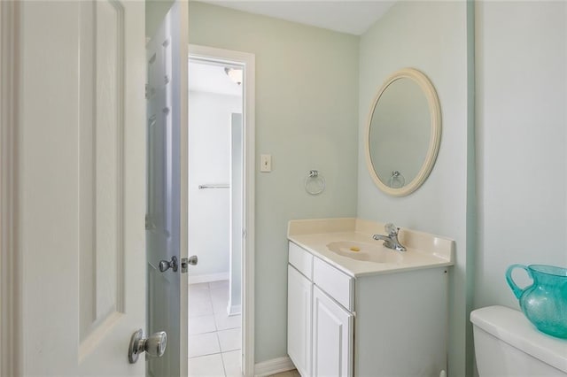 2820 Desoto St, New Orleans, LA 70119 - half bathroom with vanity, tile patterned flooring, toilet, and baseboards