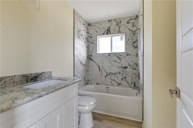 4536 Laine Ave, New Orleans, LA 70126 - bathroom with toilet, wood finished floors, shower / washtub combination, and vanity
