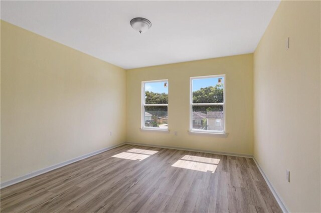 4536 Laine Ave, New Orleans, LA 70126 - unfurnished room featuring wood finished floors and baseboards