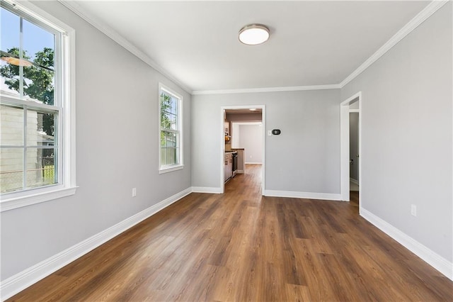 1929 Kentucky Ave, Kenner, LA 70062 - spare room with wood finished floors, crown molding, and baseboards