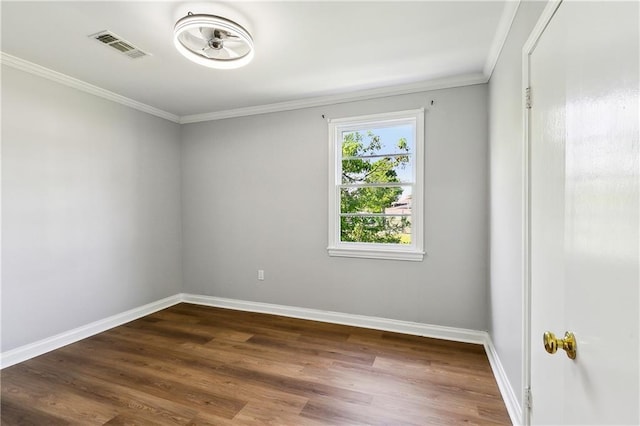 1929 Kentucky Ave, Kenner, LA 70062 - spare room featuring crown molding, baseboards, visible vents, and dark wood-style flooring