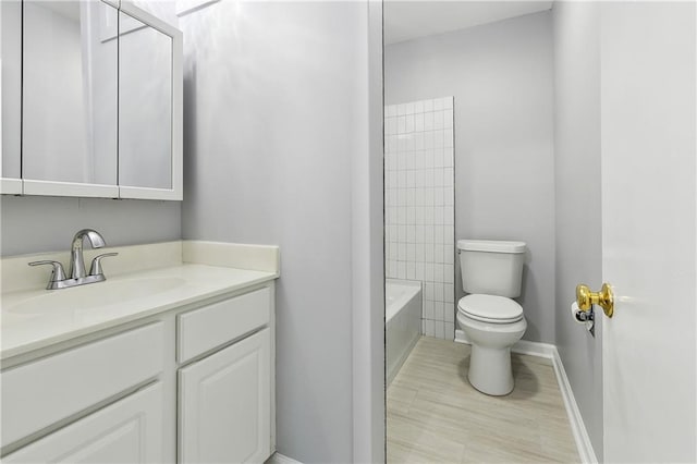 1929 Kentucky Ave, Kenner, LA 70062 - full bathroom with toilet, vanity, and baseboards