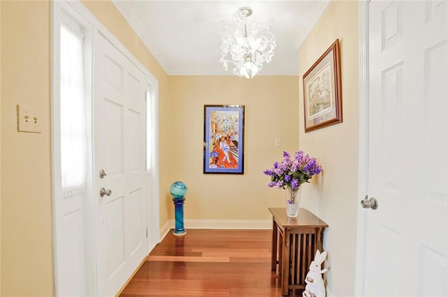 9621 Charlotte Dr, River Ridge, LA 70123 - entryway featuring a chandelier, wood finished floors, and crown molding
